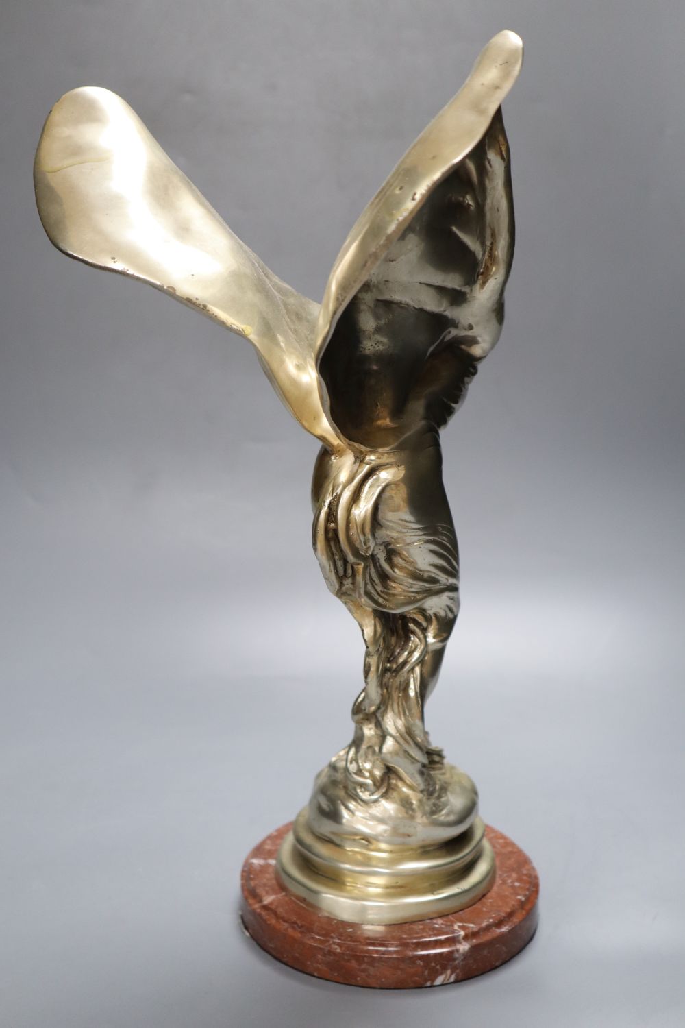 A silver plated figure in the style of Spirit of Ecstasy after Sykes, 39cm